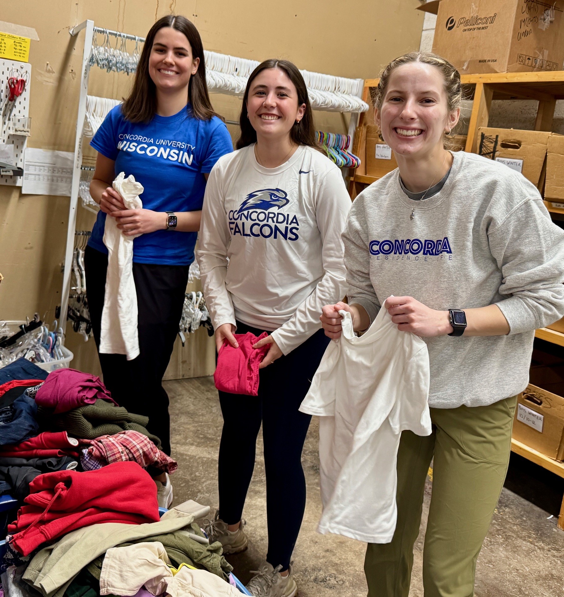 Volunteers sorting clothing at Father Gene's Help Center